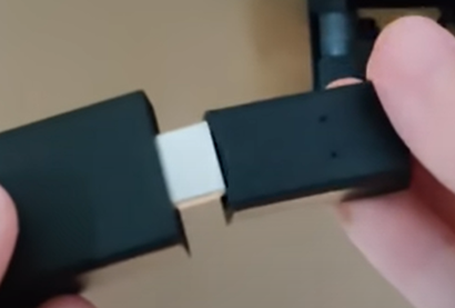 Plug one end of the adapter to the Firestick device